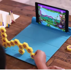 Child engaging with Shifu Plugo Link, solving puzzles with AR-powered educational game set for STEAM learning.